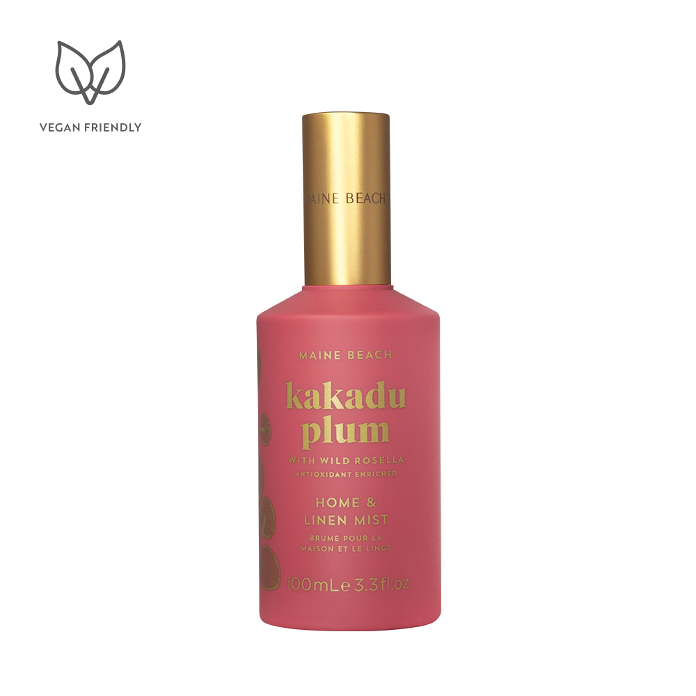 Pink bottle with gold cap labeled 'kakadu plum' on a white background