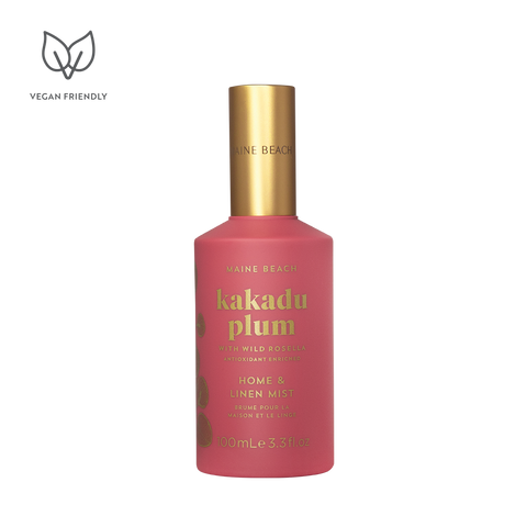 Pink bottle with gold cap labeled 'kakadu plum' on a white background