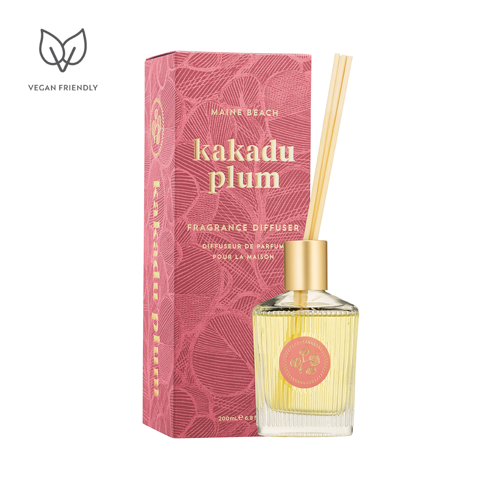 Fragrance diffuser with pink packaging labeled 'kakadu plum' on a white background